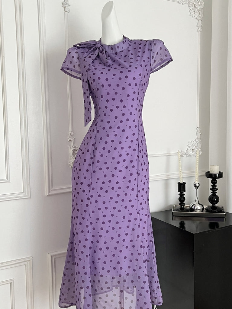 purple polka dot dress Fall in love with polka dots all over again!  Fun and full of vintage  charm, our May Purple and White Polka Dot Dress is designed to flatter and  make you dazzle