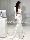White satin mermaid wedding dress with long sleeves and cut-out waist, side view with sweep train