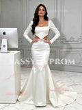 White long sleeve satin fit-and-flare wedding dress with open back and cut-out waist, fitted bodice and train