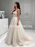 Side view of ivory lace appliqué tulle A-line wedding dress with spaghetti straps and court train
