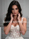 Ivory wedding dress bodice detail with beaded lace appliqués and thin spaghetti straps