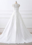 White sleeveless lace wedding dress on a mannequin with fitted bodice and long train | PicSEO 1787445863058