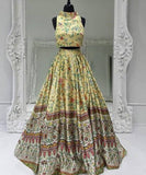 Yellow floral halter crop top and long flared skirt on a black mannequin | PicSEO 1787445875620