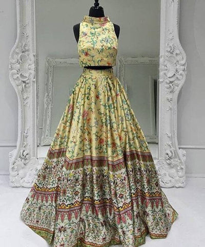 Yellow floral halter crop top and long flared skirt on a black mannequin | PicSEO 1787445875620