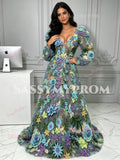 Three-quarter view of the romantic floral tulle long sleeve prom dress with vibrant embroidery and flared skirt