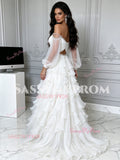Back view of a white off-the-shoulder two-piece prom dress showing the boned bustier back design, crystal belt detail, and voluminous tiered tulle ruffle skirt.