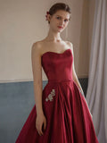 Strapless Beads Wine Red Pocktes A Line Satin Prom Dress